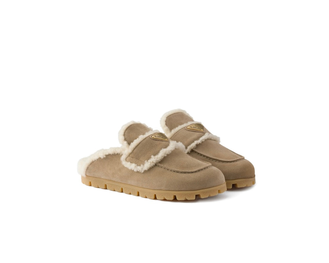 Prada
shearling logo-plaque mules